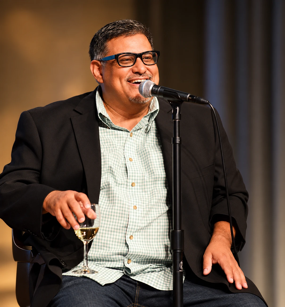 Joe Loya speaking on stage